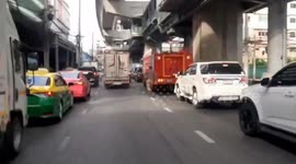 High-speed chase as officers pursue 'crazed' truck driver fleeing police checkpoint in Thailand