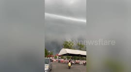 Creepy shelf cloud forms above neighbourhood in Thailand