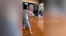 Terrified resident drives away snake using broomstick