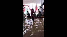 Boats used to evacuate bride and groom as flooding halts wedding in Vietnam