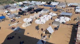 Hundreds of tents set up at makeshift shelter as thousands of displaced Palestinians journey to Rafah