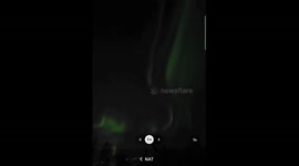 Enchanting Northern Lights illuminate Tromso's night sky in mesmerizing green hues