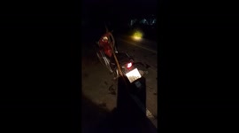 Shocked rider finds huge python coiled round motorcycle