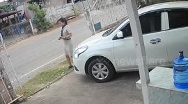 Iron gate topples over onto family's new car