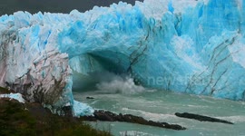 Tourists in awe as HUGE chunk of glacier collapses and crashes into ocean
