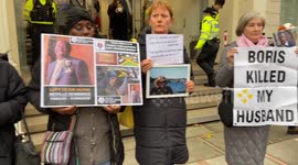 Protesters and bereaved family members gather outside the Boris Johnson Covid-19 Inquiry Hearing on second day