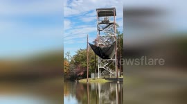 Soldier yells 'Go Army' while racing down zip line into lake