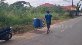 Villagers rescue newborn stuffed in plastic bag and dumped near rubbish bin in Thailand