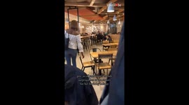 Woman in utter astonishment after 20 of her friends surprise her for her birthday holiday