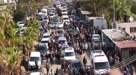 Mourners carry the bodies of six Palestinians during their funeral in Faraa refugee camp, West Bank