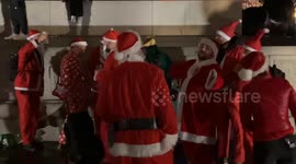 Dozens of drunk Santas gather in Trafalgar Square for Santacon 2023