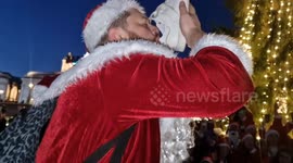 Merry Santas gather in Trafalgar Square for photo op and drink booze from SHOE