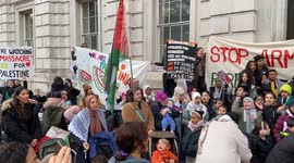 Parents and children call for a ceasefire in Palestine outside Downing St
