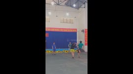 Four people demonstrate their skills in playing street shuttlecock in Vietnam