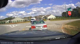 Turning Car Collides With Postal Van