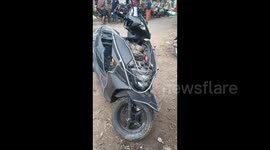 Fire fighters rescued a 7 feet long cobra snake hiding inside a bike which was submerged in recent flood