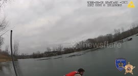 Police officer crawls across frozen lake to rescue two fishermen and a dog