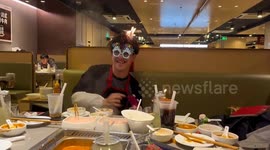 Man's hair ignited by candle on cake during birthday celebration in China