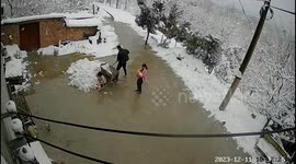 Dad rescues toddler after massive pile of snow falls from roof
