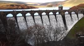Craig Goch Dam overflowing, Elan Valley, Mid Wales, UK.  13 December 2023.