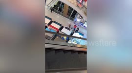 Energetic boy jumps on display beds in mall