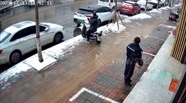 Chinese woman's kind gesture exploited as scooter rider seizes dropped cash unnoticed
