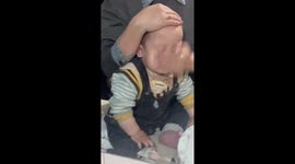 Chinese mother gives her baby a very rough face wash