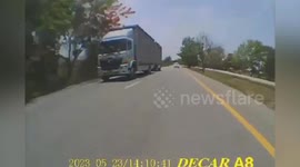 Pickup truck serves along road and crashes through barrier