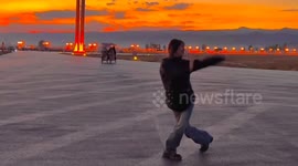 Chinese girl performs graceful Mongolian dance at sunset