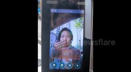 Chinese woman tricks facial recognition with hand-cover mimicry of face mask