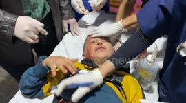 Medics tend to wounded Gazans after Israel bombs refugee camp