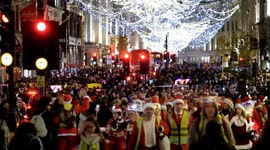 Hundreds of Santas wheel and skate through a heaving West End spreading joy and festive cheer