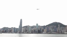 China's homegrown C919 aircraft flies over Victoria Harbor in HK