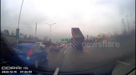 Unsecured truck cargo compartment sends overhead gantry toppling in eastern China