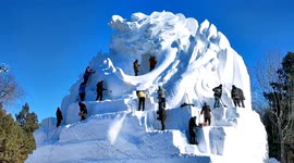 Chinese sculptors unite to craft massive snow dragon