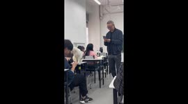 Obedient stray cat joins university students in class