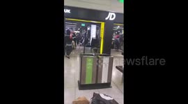 Youth lobs fire extinguisher at man during violent brawl in UK sports store