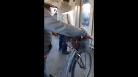 Rush hour chaos: commuters boarding through train windows for seats