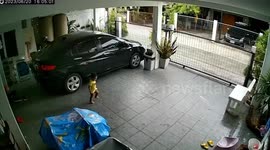 Toddler slips on wet floor while running away from father