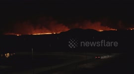 Sky glows red as volcano erupts on Icelandic peninsula, posing threat to nearby town