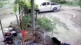 Pickup rolls backwards on bicycle and drags it along dirt path