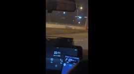 Motorist flags down truck driving along highway with flaming hay bales