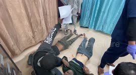 Injured Palestinians (includ children) are brought to a hospital following an Israeli strike in Dair El-Balah in the Central Gaza Strip.