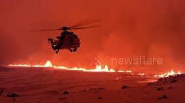 Helicopter Monitors Iceland Volcano