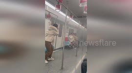 Metro wagons fill with smoke after truck catches fire on the street
