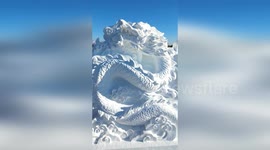 Sculptors at winder festival carve massive dragon from snow