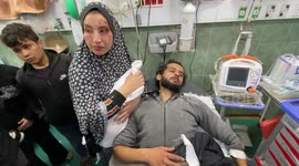 People attend the funeral prayer for Palestinians, who died in the Israeli airstrikes mourn ahead of the funeral ceremony at the Hospital in Rafah