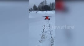 Determined rescuers save dog who fell through ice twice in same day