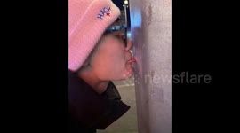 Curiosity got the better of this Chinese man after he found out what happens when you lick a frozen lamppost