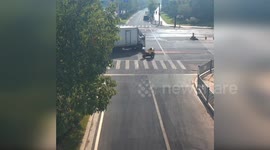 Delivery rider rescued from under truck after crossroad accident